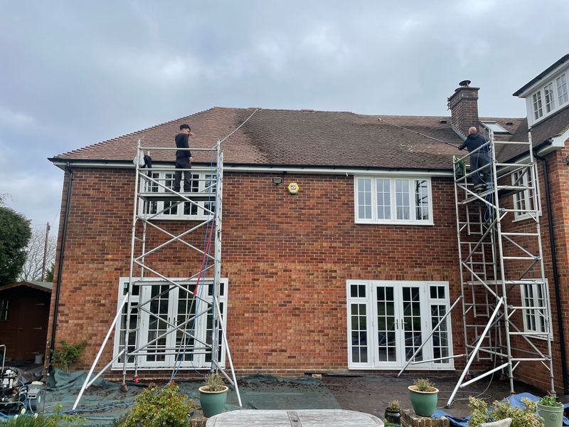 Roof cleaning carried out safely from scaffold towers by The Roof Moss Cleaners in Charlbury